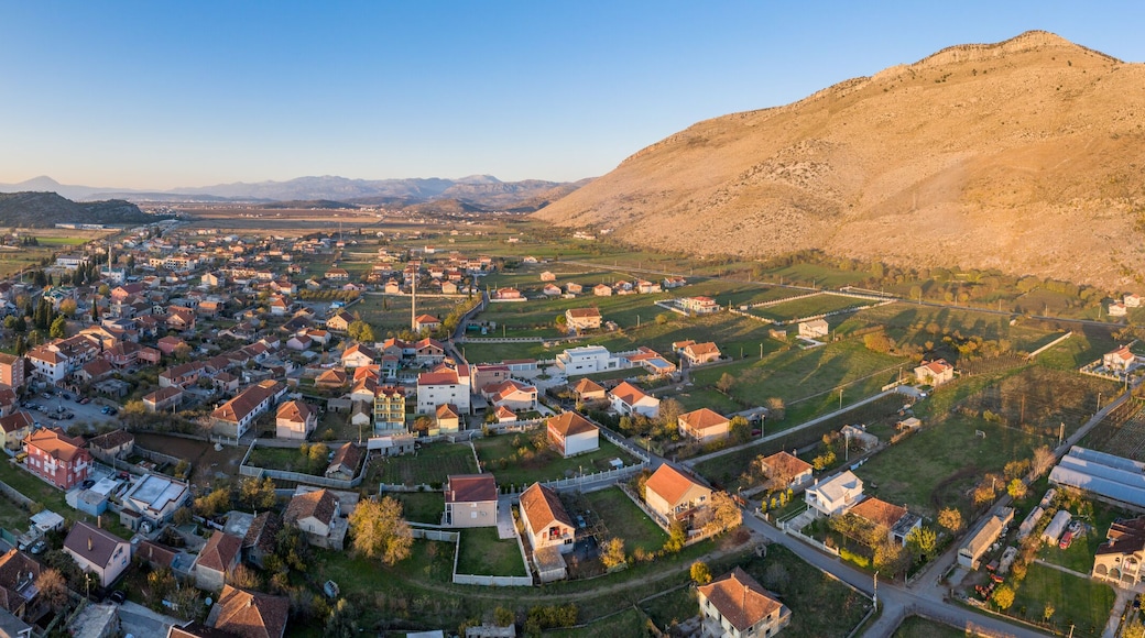 Tuzi, the youngest municipality in Montenegro, in the afternoon, close to sunset. Center of Malesi e Madhe District, populated mainly by Malisors. Situated at the foot of Decic hill. Aerial shot.