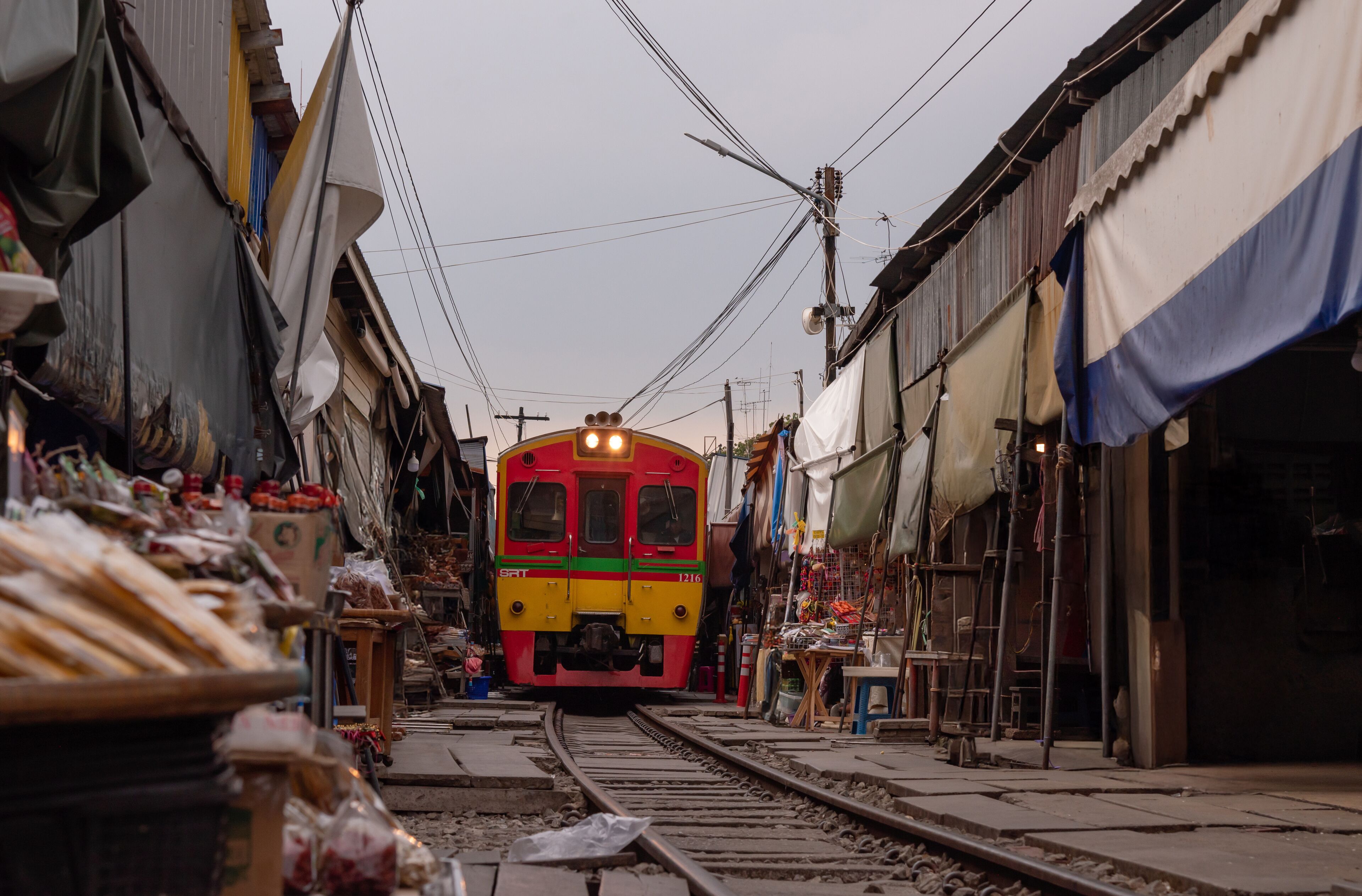 The most beautiful viewpoints Maeklong Railway Market (Talad Rom Hoop) In Samut Songkhram, Thailand.