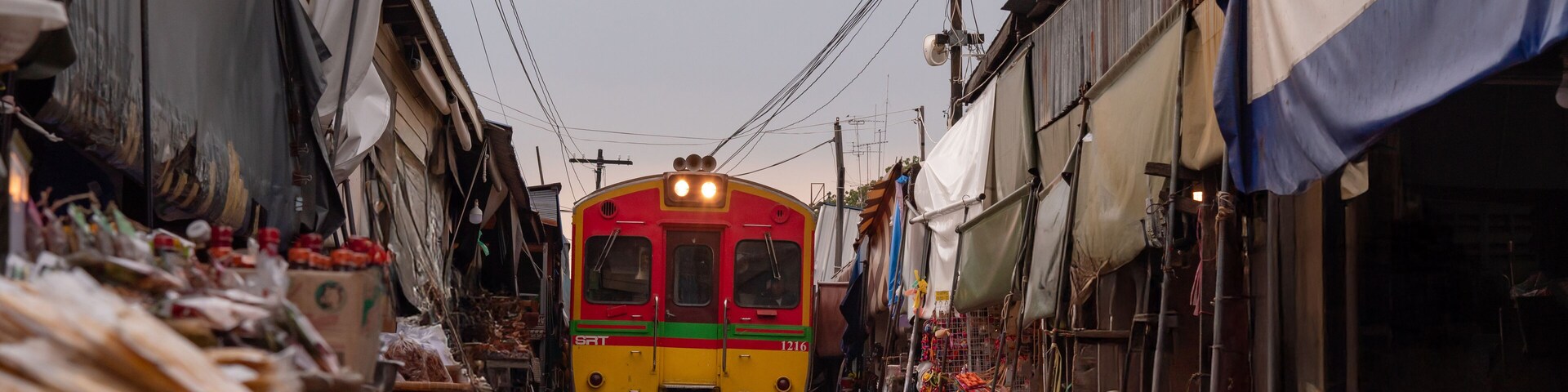 The most beautiful viewpoints Maeklong Railway Market (Talad Rom Hoop) In Samut Songkhram, Thailand.