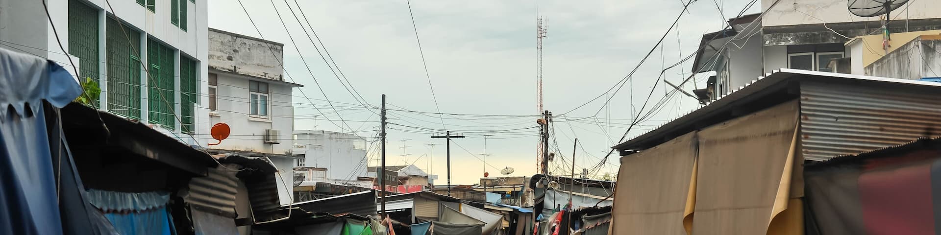Landscape view of Rom Hoop Market (The folding umbrella market ) at Samut Sakhon city, Thailand