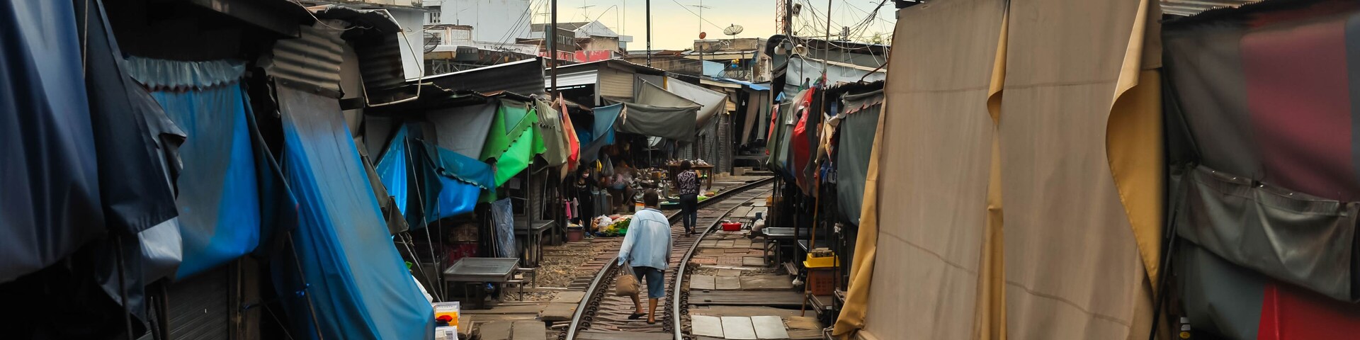 Landscape view of Rom Hoop Market (The folding umbrella market ) at Samut Sakhon city, Thailand