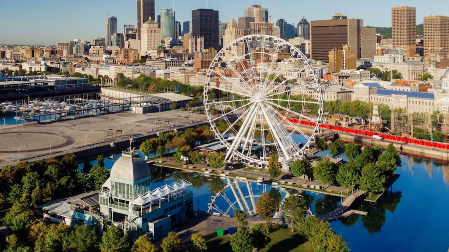 Ferris Wheel, Vieux-Port de Montréal and downtown city skyline, Montreal, Quebec, Canada.