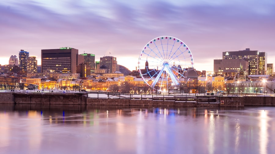 Sunset in winter over Montreal old port and ferris wheel in Quebec