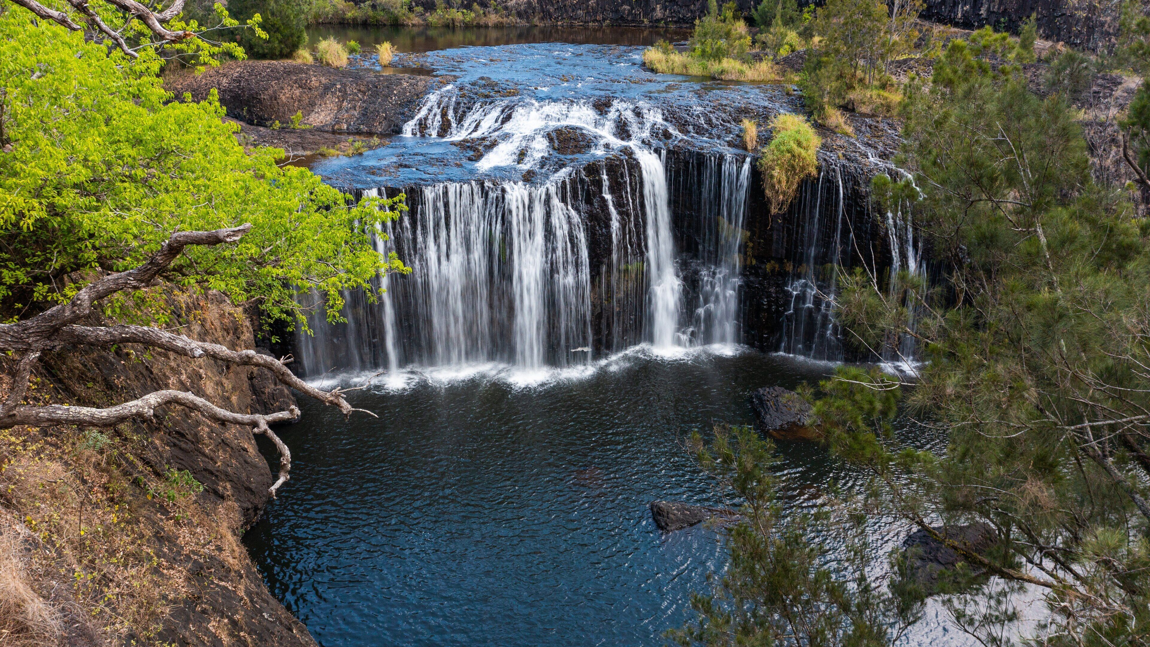 Millstream Falls National Park which includes a river or creek and a waterfall