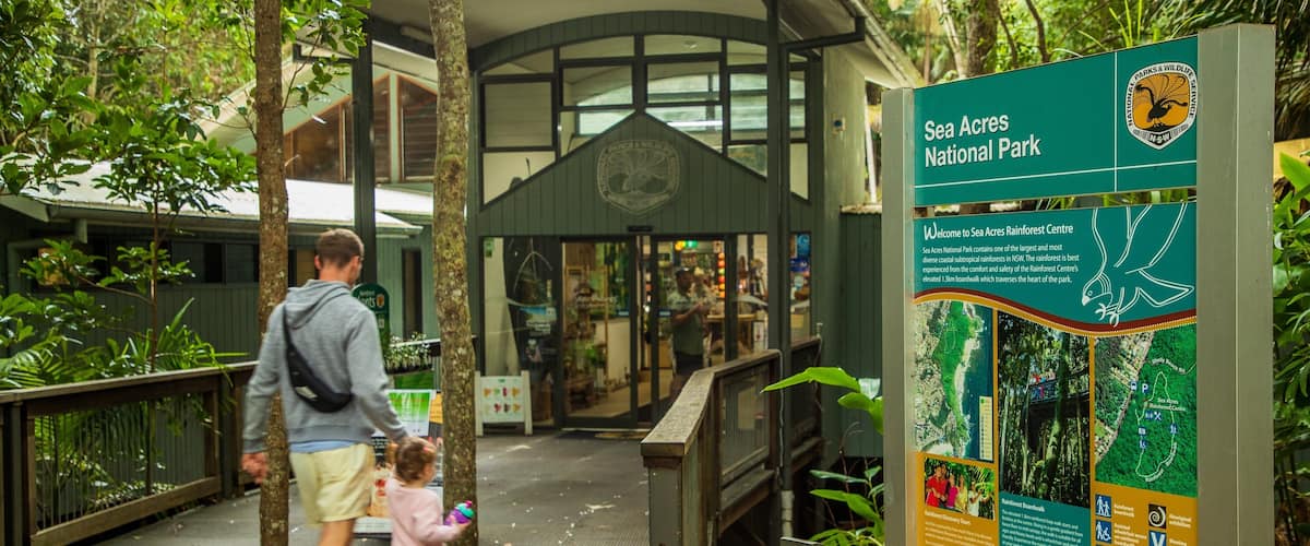 Sea Acres National Park which includes signage as well as a family