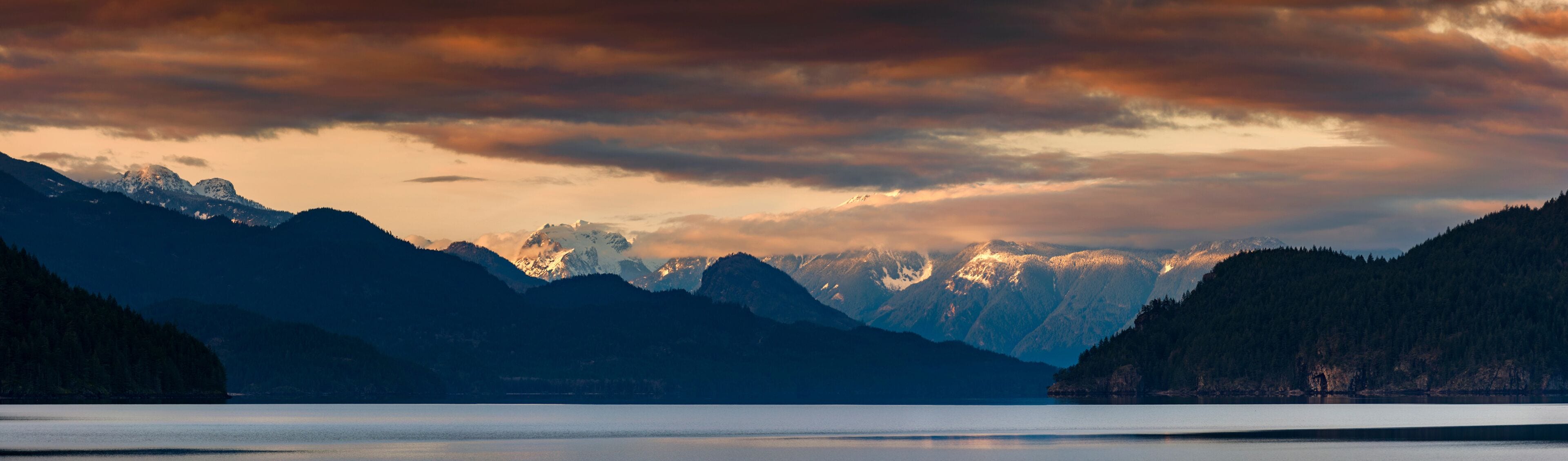 Harrison Lake is the largest lake in the southern Coast Mountains of Canada. The view from the lakefront is dominated by Breckenridge Glacier in the distance and by Echo Island. Lake Harrison, British