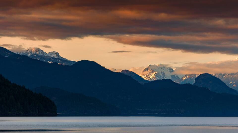 Harrison Lake is the largest lake in the southern Coast Mountains of Canada. The view from the lakefront is dominated by Breckenridge Glacier in the distance and by Echo Island. Lake Harrison, British