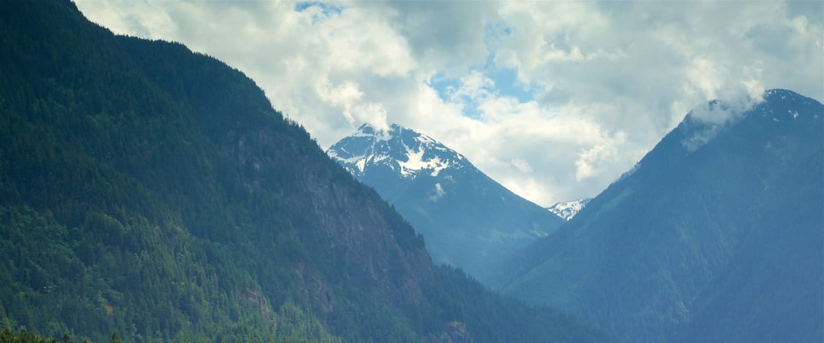 Hope which includes mountains, a lake or waterhole and tranquil scenes