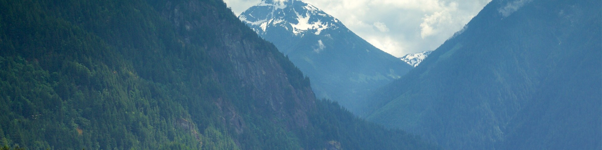 Hope which includes mountains, a lake or waterhole and tranquil scenes