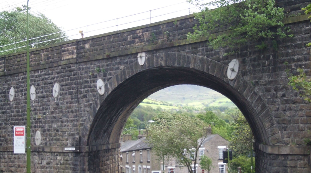 Broadbottom is a village, near Hyde, Greater Manchester in the valley of the River Etherow. From Mottram Road, Market Street by Gorsey Brow, looking under the south through railway arch towards Charlesworth. Camera location 53° 26′ 27.24″ N, 2° 00′ 37.8″ W View this and other nearby images on: OpenStreetMap - Google Earth 53.440900; -2.010500