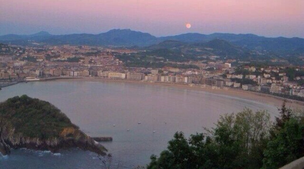 San Sebastián at sunset. Short hike or gondola ride to the top of the viewpoint. There's an awesome old school amusement park at the top of the mountain