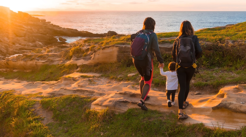 Two women with a child on the coast of Mount Jaizkibel next to San Sebastian, Pais Vasco