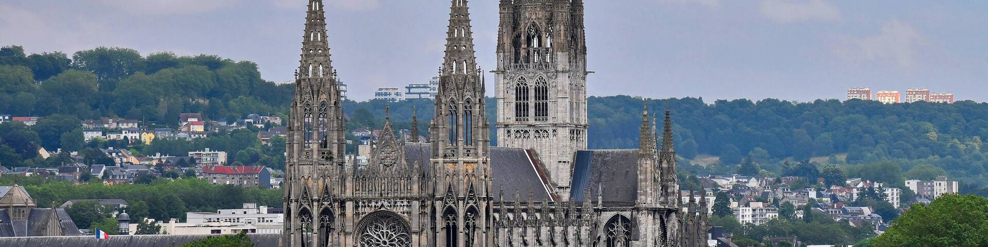 Beautiful Gothic cathedral Abbatiale Saint-Ouen and gray roofs in Rouen, France