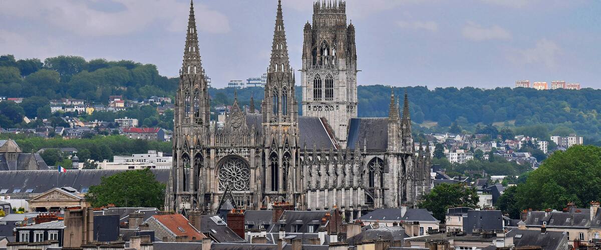 A Gothic cathedral with two spires and a large rose window.