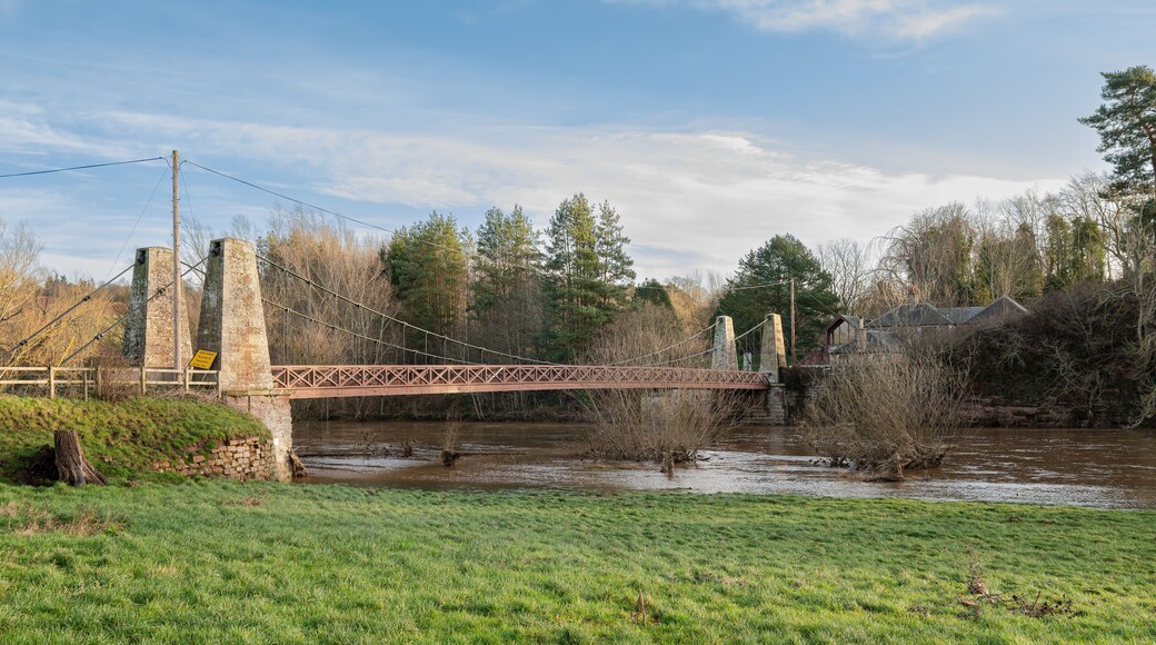 Kalemouth Suspension Bridge over the Teviot River in flood after storm Gerrit in December 2023, Scottish Borders, UK