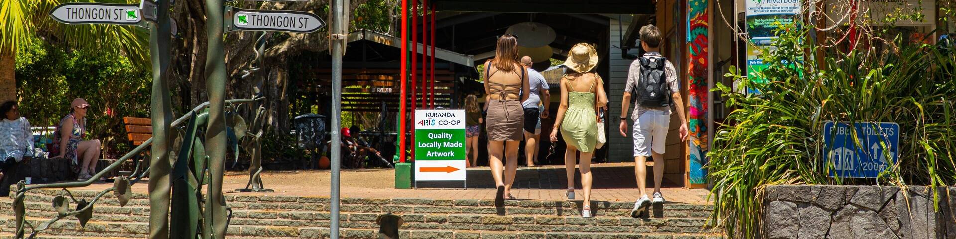 Kuranda featuring street scenes as well as a small group of people