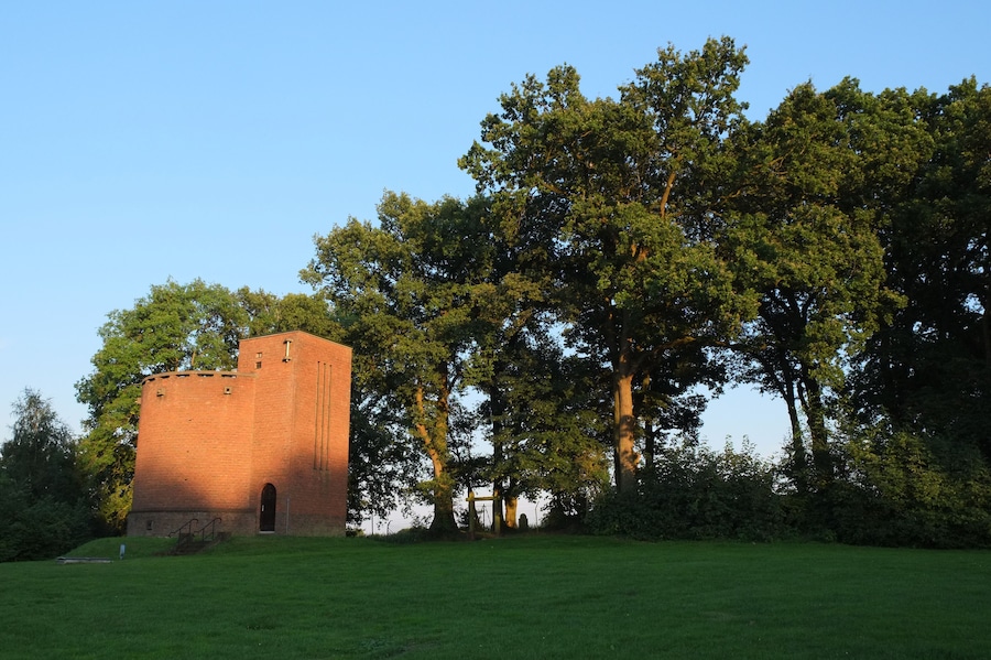 Sun is setting at the water tower of Ootmarsum (Overijssel, The Netherlands). Build in 1934, it reminds us of the style of the Amsterdam school. It lies next to the Jewish cemetery on the Kuipersberg