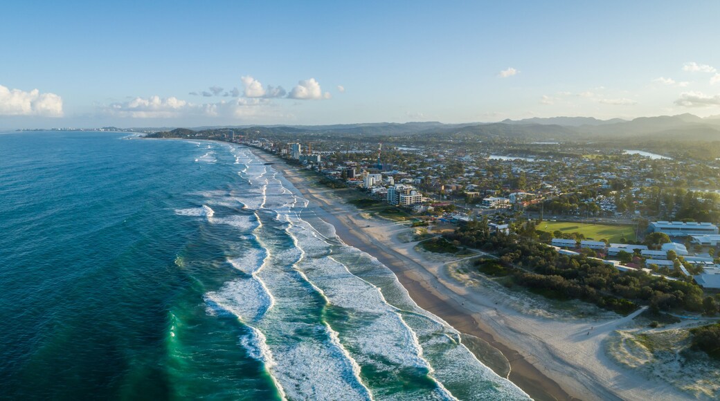Aerial panorama of Palm Beach suburb and ocean coastline at sunset. Gold Coast, Queensland, Australia