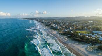 Aerial panorama of Palm Beach suburb and ocean coastline at sunset. Gold Coast, Queensland, Australia