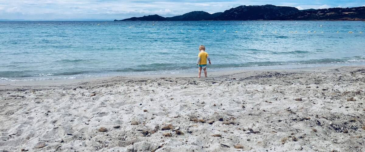 This was my two year old son's first visit to a beach. Having never been overly keen in water, he was fascinated with the beautiful aquamarine sea and wandered straight over to explore. We had a wonderful morning splashing around in the water as the clouds cleared and will always remember this moment. 
Top tip: there's one point of entry, turn left from the restaurant and you'll find the clearest part of the sea, not a stone in sight. 
#LifeAtExpedia