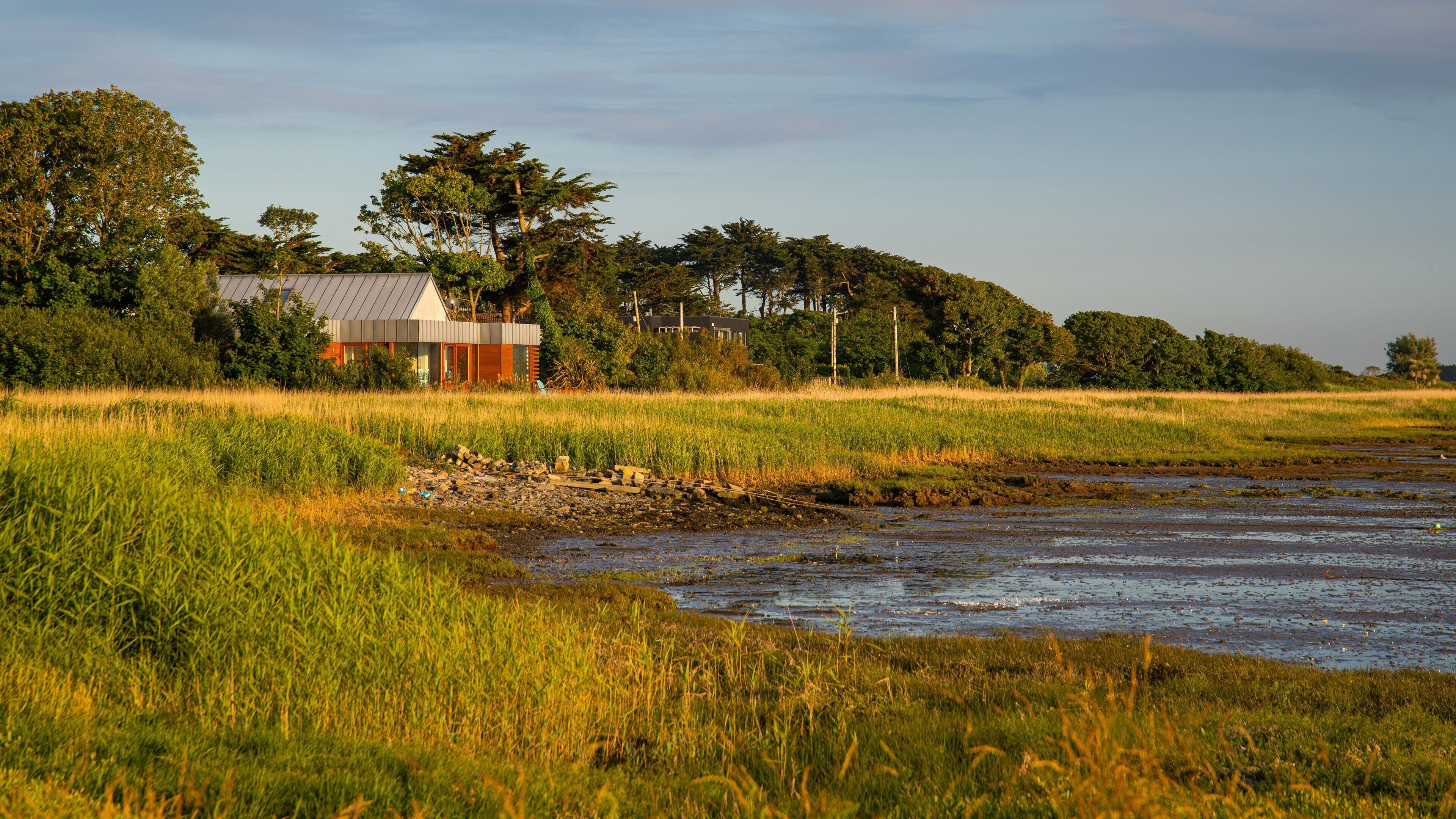 Rosslare which includes tranquil scenes and a lake or waterhole