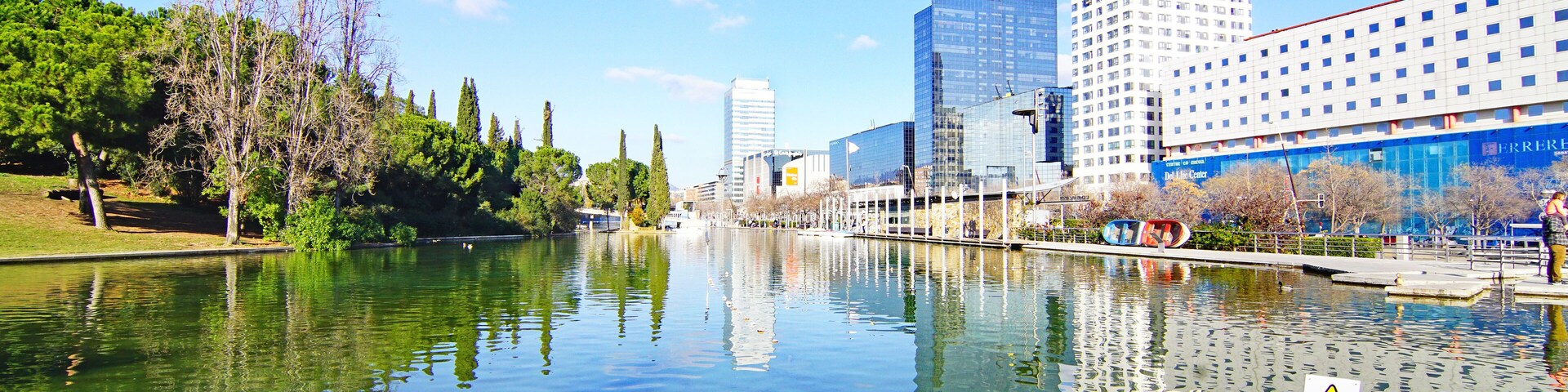 A river reflecting buildings and trees.