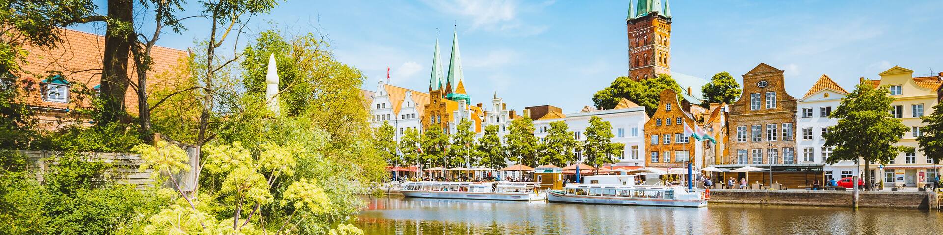 Classic panorama view of the historic city of Luebeck with famous Trave river in summer, Schleswig-Holstein, Germany, Shutterstock ID 1193452930, Purchase Order: SP-1506 Go Guides, Order Number: , Cli
