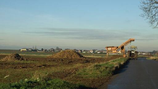 Root Crop Cleaning near Winteringham. This piece of agricultural machinery seen on the Winterton Road removes earth from root crops.