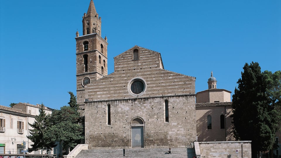 A historic church with a bell tower and a dome.