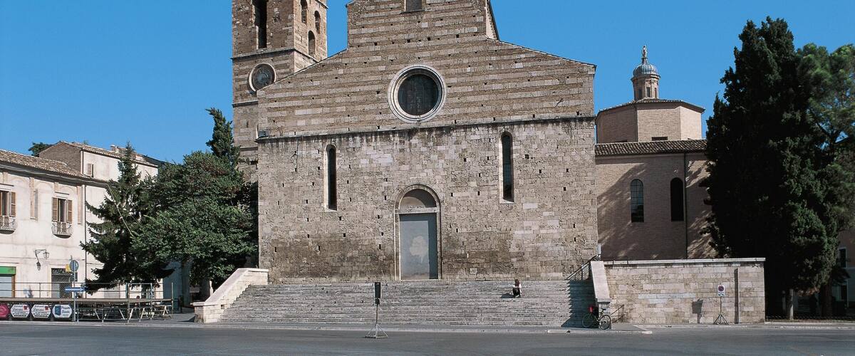 A historic church with a bell tower and a dome.