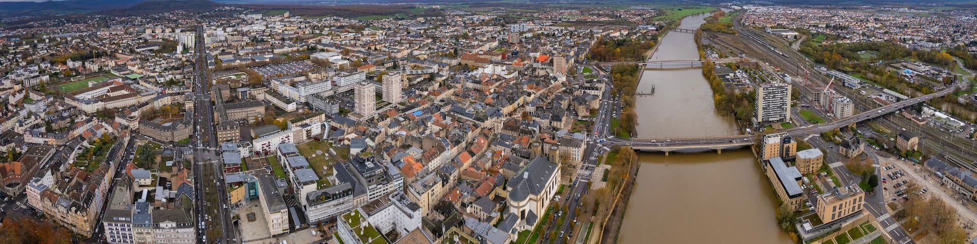 An aerial panorama view around the downtown of the City Thionville In France on a cloudy spring noon