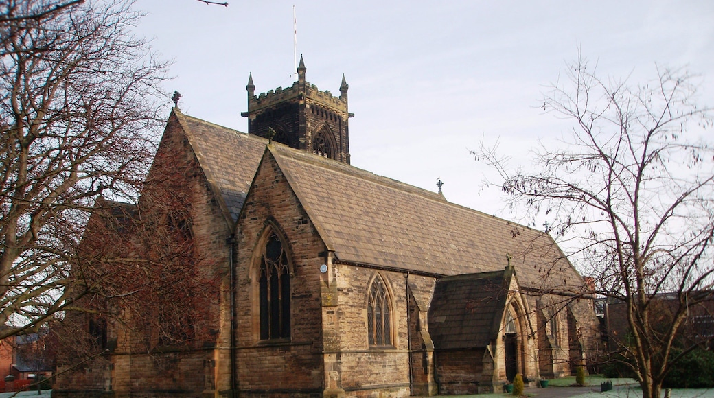 Church of St Paul the Apostle, Thornaby This photograph of the church in North Thornaby was taken from just inside the church grounds near the junction of Cambridge Road with Thornaby Road (A1045). Notice the two different 'colors' of the grass: that on the right has an early-morning frost while that on the left has thawed out.