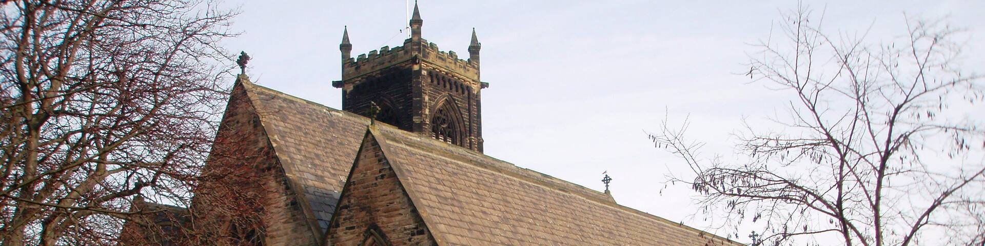 Church of St Paul the Apostle, Thornaby This photograph of the church in North Thornaby was taken from just inside the church grounds near the junction of Cambridge Road with Thornaby Road (A1045). Notice the two different 'colors' of the grass: that on the right has an early-morning frost while that on the left has thawed out.
