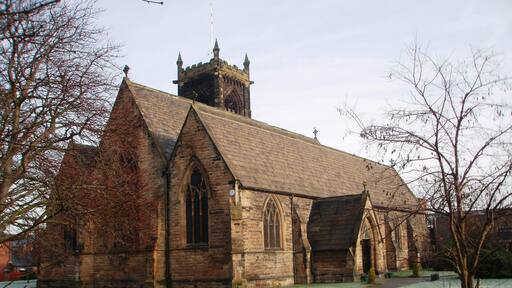 Church of St Paul the Apostle, Thornaby This photograph of the church in North Thornaby was taken from just inside the church grounds near the junction of Cambridge Road with Thornaby Road (A1045). Notice the two different 'colors' of the grass: that on the right has an early-morning frost while that on the left has thawed out.