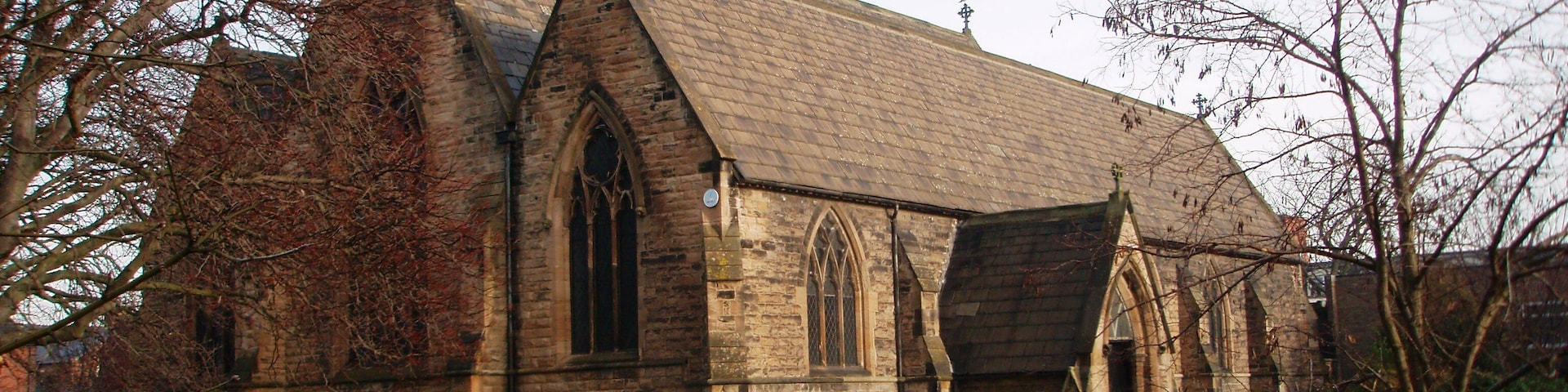 Church of St Paul the Apostle, Thornaby This photograph of the church in North Thornaby was taken from just inside the church grounds near the junction of Cambridge Road with Thornaby Road (A1045). Notice the two different 'colors' of the grass: that on the right has an early-morning frost while that on the left has thawed out.
