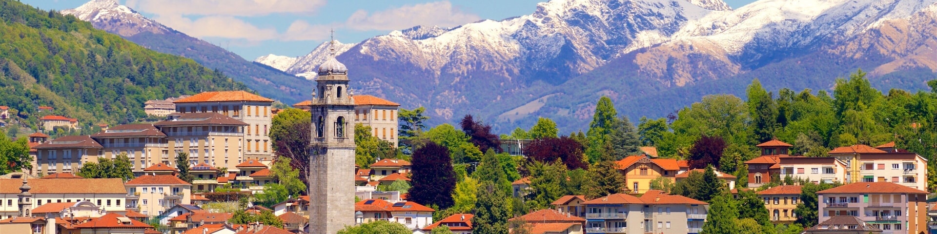 Verbania showing a lake or waterhole, mountains and a small town or village