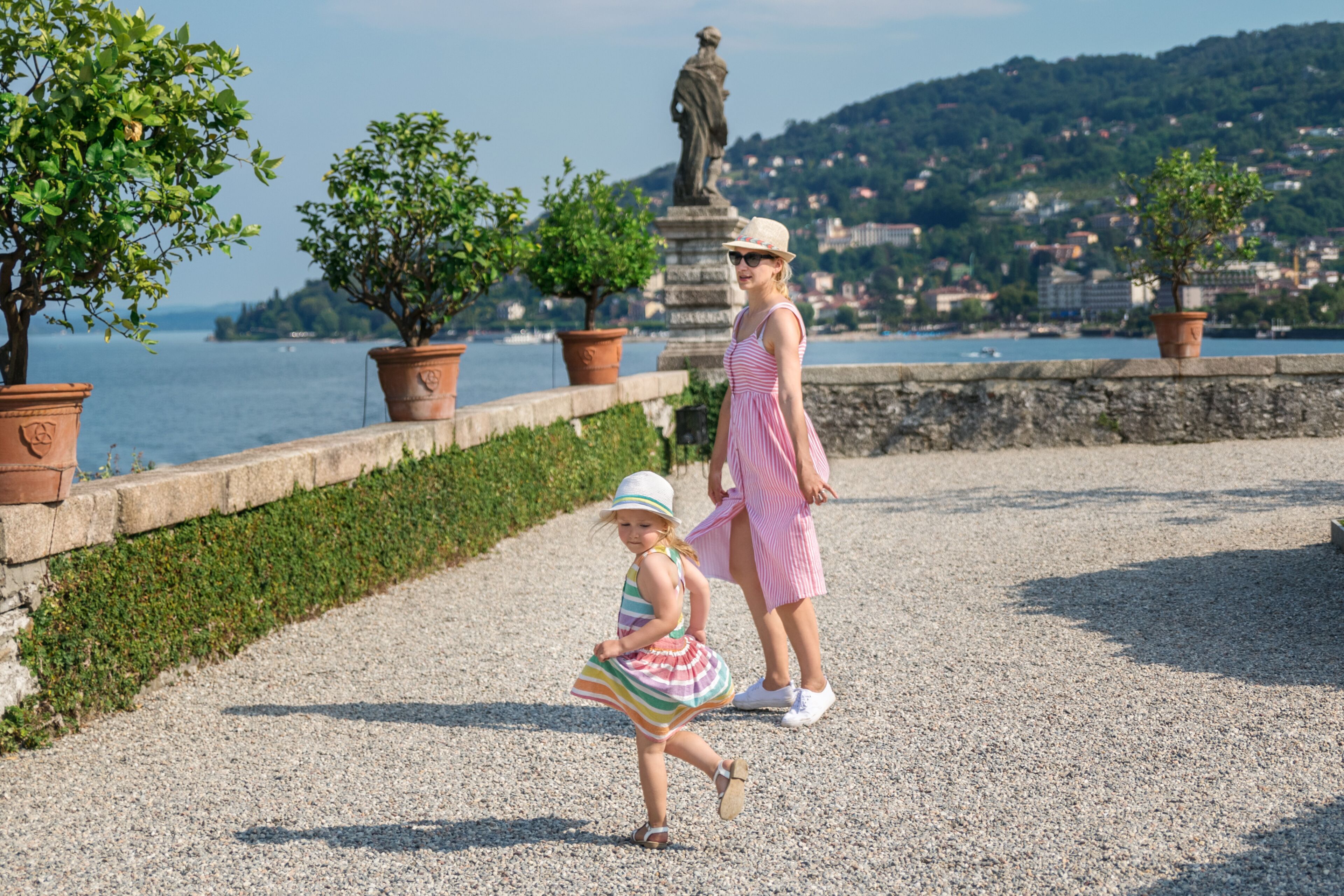 Mother and daughter dancing on the island of Isola Bella on Lake Maggiore