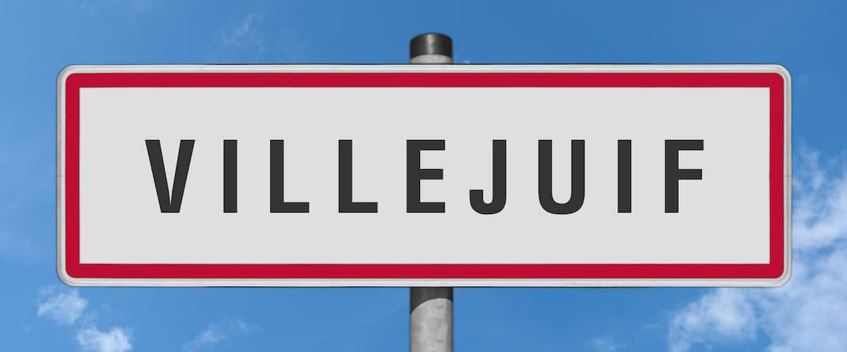 A street sign with the word 'VILLEJUIF' against a clear blue sky.