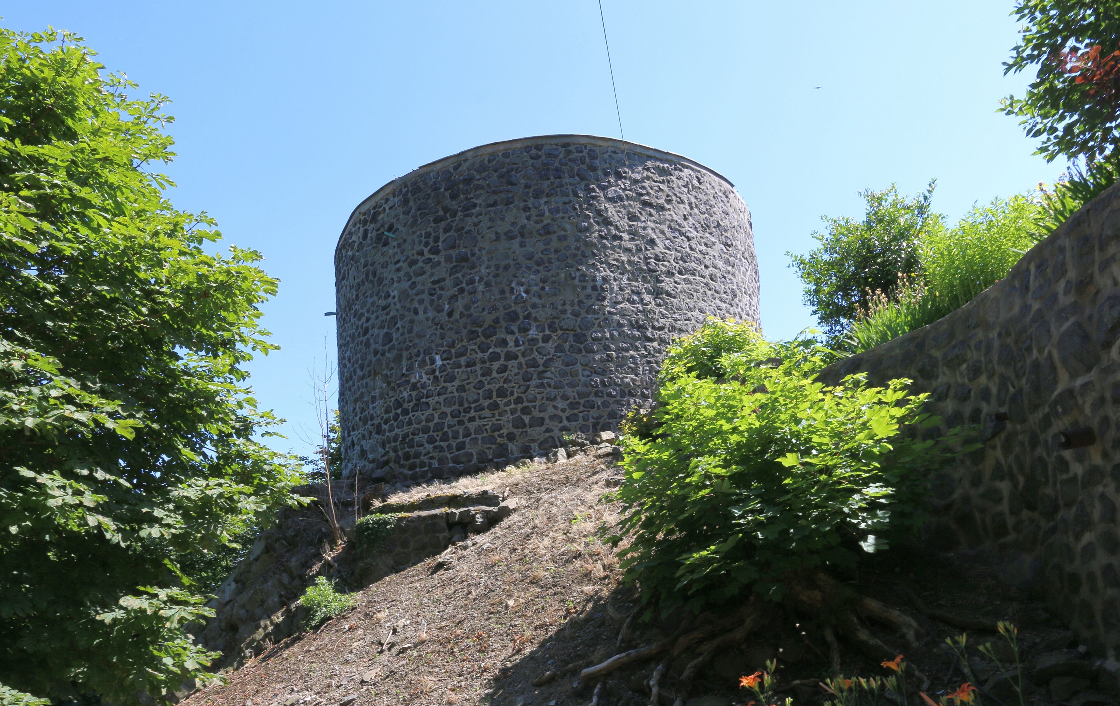 A stone tower surrounded by trees.