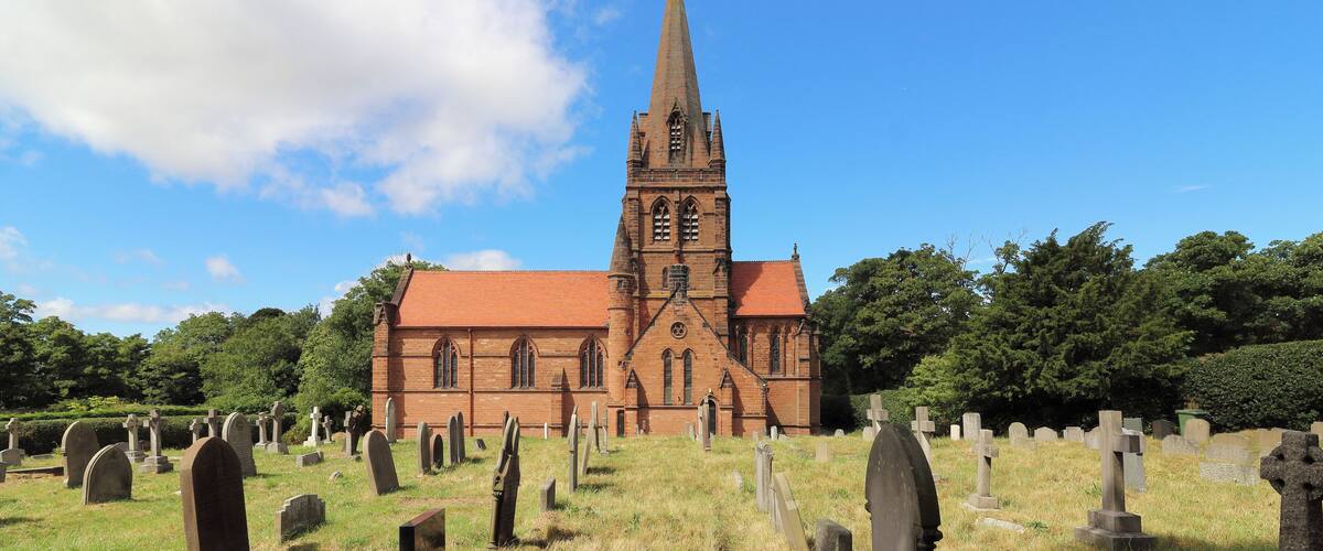 View north across the churchyard to St Bartholomew's, Thurstaston