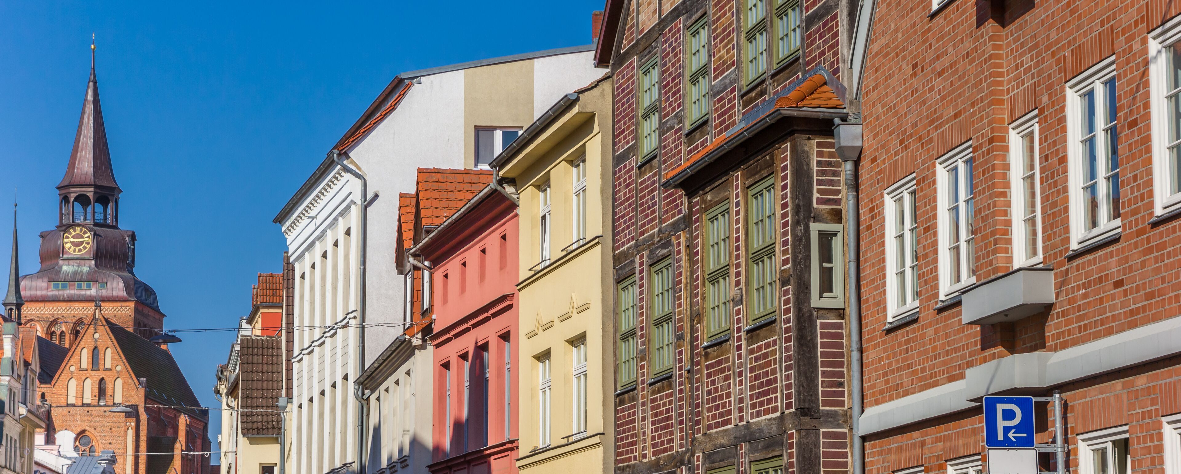 Panorama of historic facades and church tower in Gustrow, Germany
