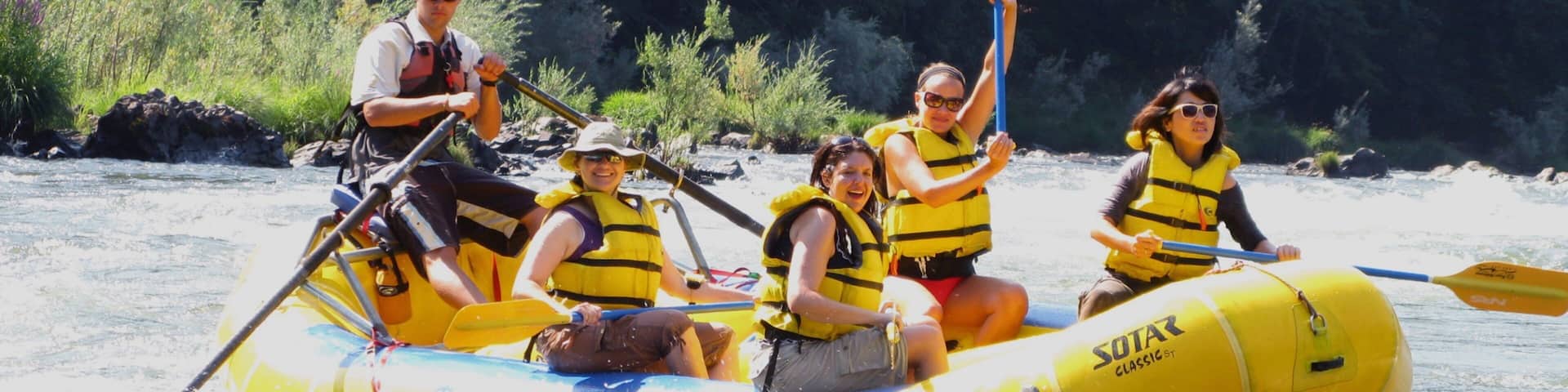 Rogue River which includes rapids and rafting as well as a small group of people