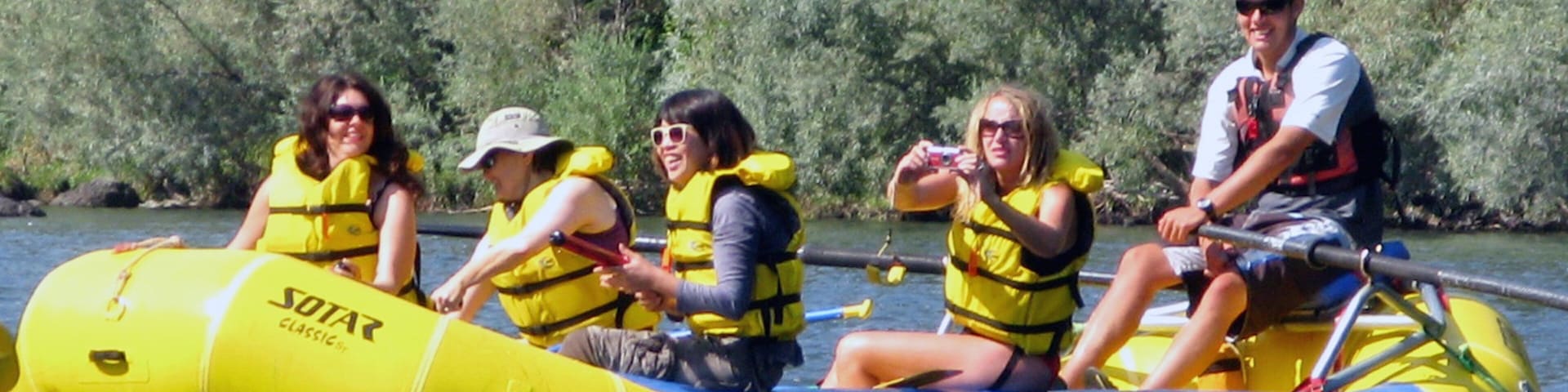 Rogue River featuring a river or creek and rafting as well as a small group of people