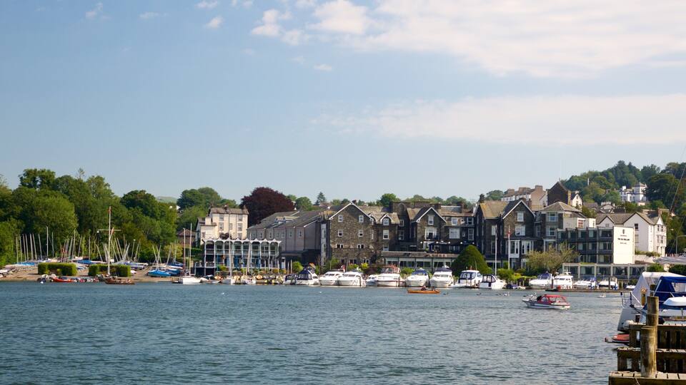 A harbor with boats, a row of buildings, and a clear sky.