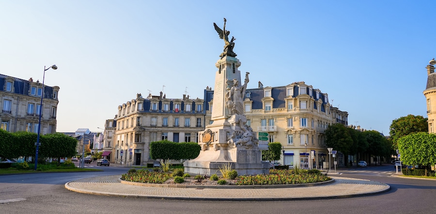 Place de la République ("Republic's Square") in Soissons, France - Roundabout with a classic sculpture celebrating freedom topped with a winged angel carrying a torch