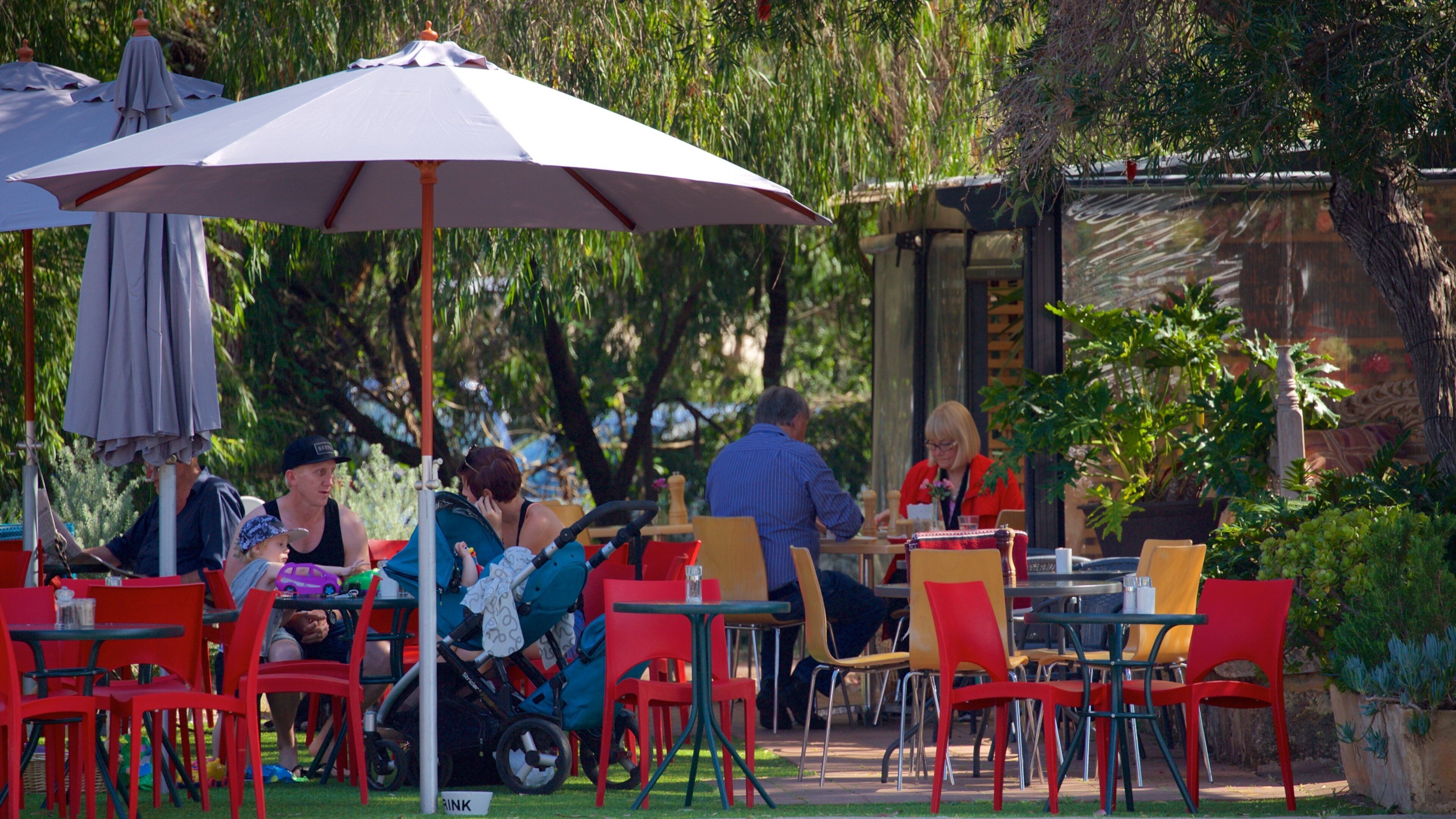 Dunsborough which includes outdoor eating and a park as well as a small group of people