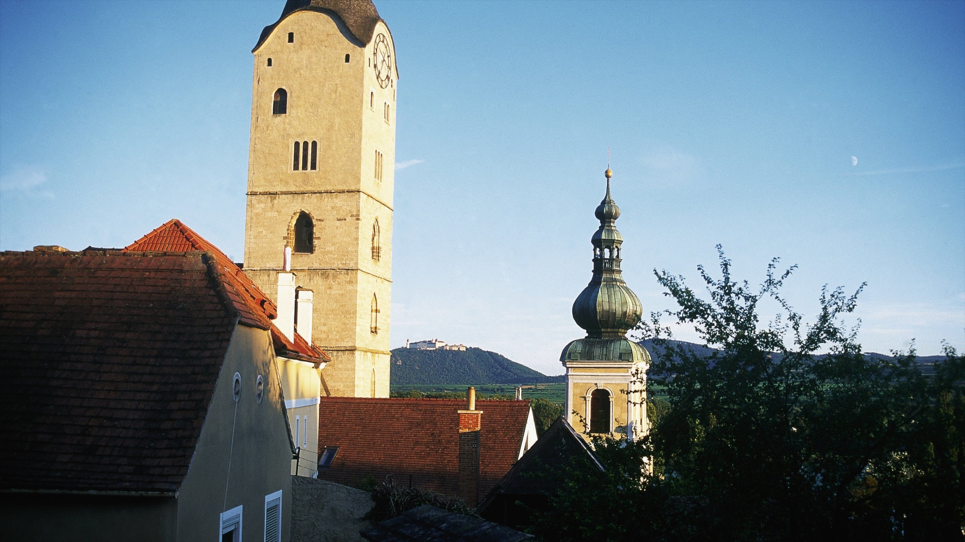 A church with a tall bell tower and a dome.