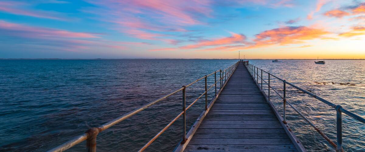 Robe pier with early bird fishermen during sunrise, Limestone Coast, South Australia