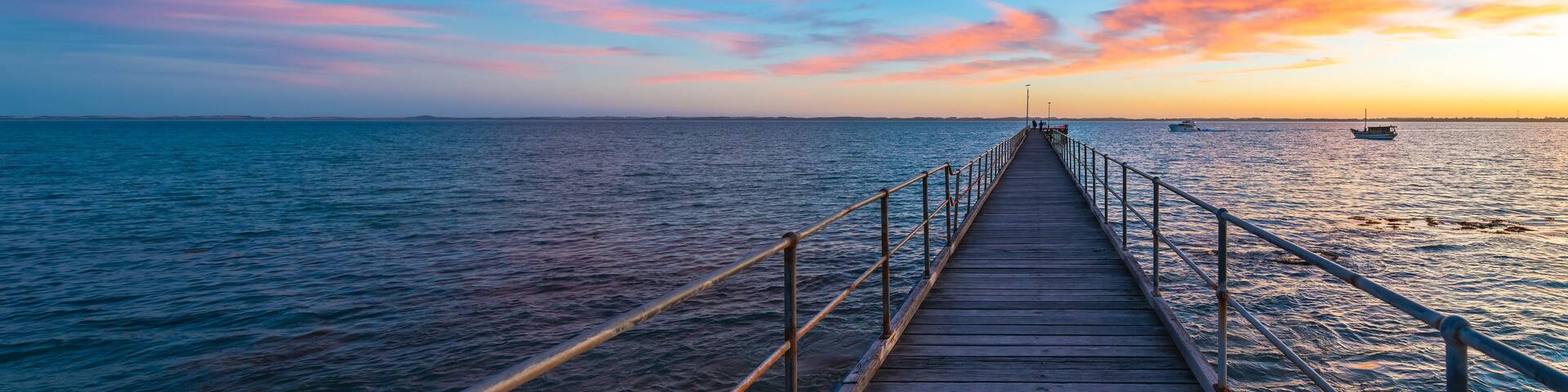Robe pier with early bird fishermen during sunrise, Limestone Coast, South Australia