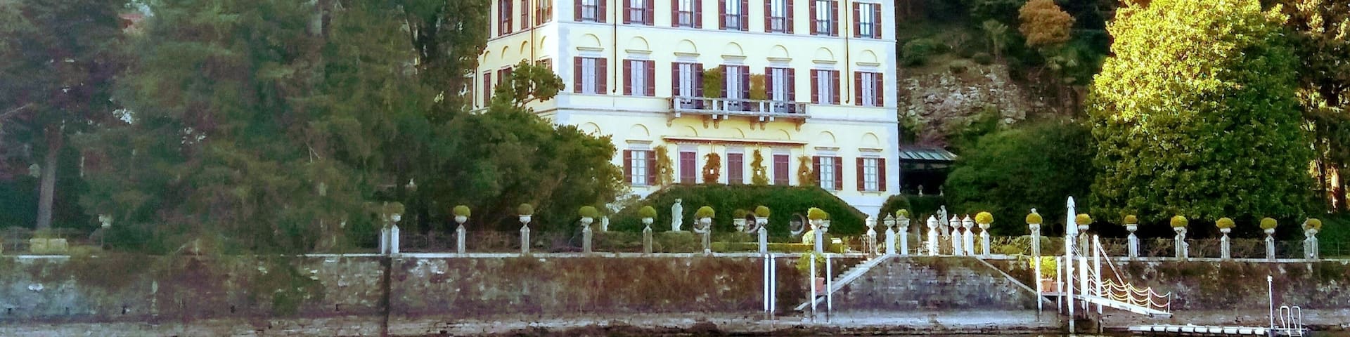 Villa Le Fontanelle: Home to Celebrities
Present owner of this magnificient Villa is Russian millionaire Arkady Novikov who bought it in 2008 for a price of 33 million Euros.
It was previously owned by Gianni Versace from 1977 until his murder in 1997. Before his death, celebrities such as Sir Elton John, Sting and Madonna were guests in the building.
Since the death of Versace, only American singer Jennifer Lopez and her husband Chris Judd spent their honeymoon there. It is not open to the public but can be viewed from the lake.
The Villa itself "Le Fontanelle" was originally built in 1776 and owned prior to Versace by the Cambiaghi family. Versace purchased this magnificent villa in 1977 and completely refurbished the property ay huge expense. He restored the elegant neo-classic style true to their original design and Versace supervised every element of the restoration and furnished the villa personally.
Question is: How much money are people ready to spend for this luxury Villa? Yes they are more than ready! Yes, Villa has its own history to tell... , but 33m€?!? Wooow!
#LagodiComo
#LakeComo
#Italy